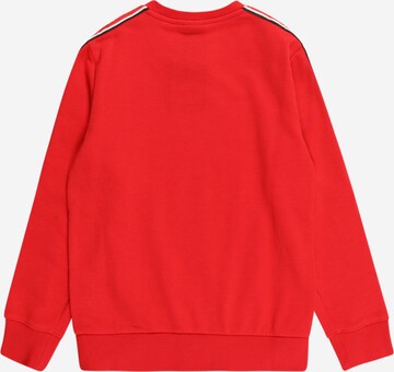 Champion Authentic Athletic Apparel Sweatshirt i röd