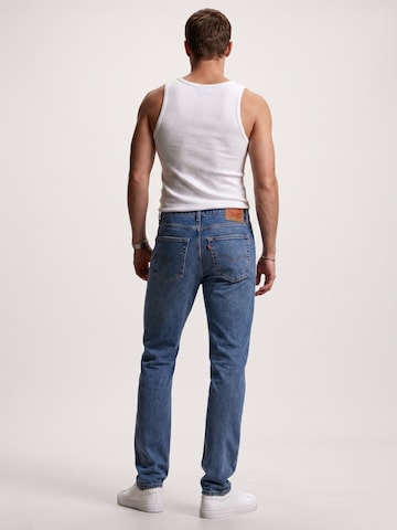 LEVI'S ® Luźne Jeansy '512 SLIM TAPER COOL AS A CUCUMBER ADV MED INDIGO' w kolorze niebieski