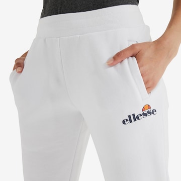 ELLESSE Zúžený Kalhoty – bílá