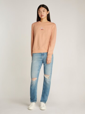 Felpa di Calvin Klein Jeans in arancione