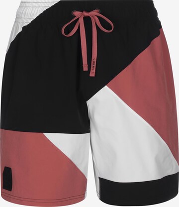 Loosefit Pantalon de sport 'Curry Woven 7' UNDER ARMOUR en rouge : devant
