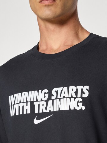NIKE - Camiseta funcional 'WINNING' en negro