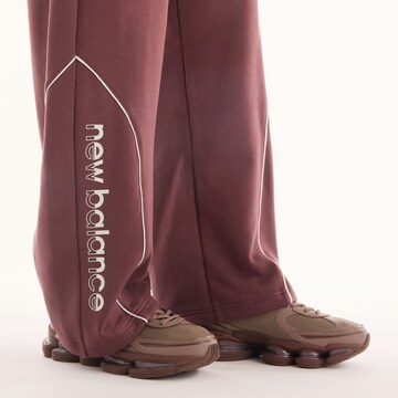Wide leg Pantaloni 'Trackside French Terry Pant' di new balance in rosso