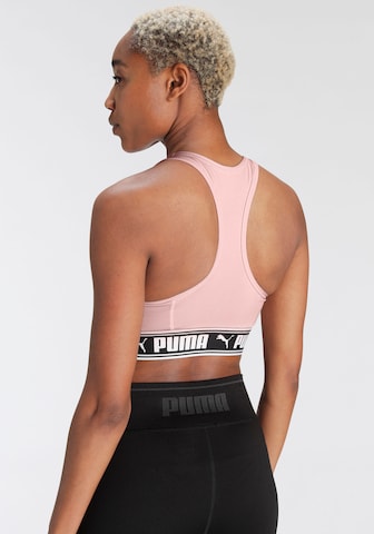 Bustino Reggiseno sportivo di PUMA in rosa