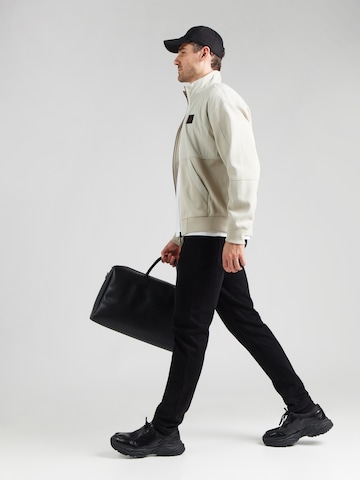 BOSS Orange Välikausitakki värissä beige