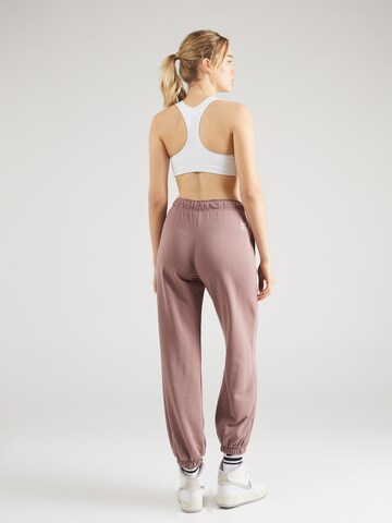 Nike Sportswear - Tapered Pantalón 'AIR' en lila