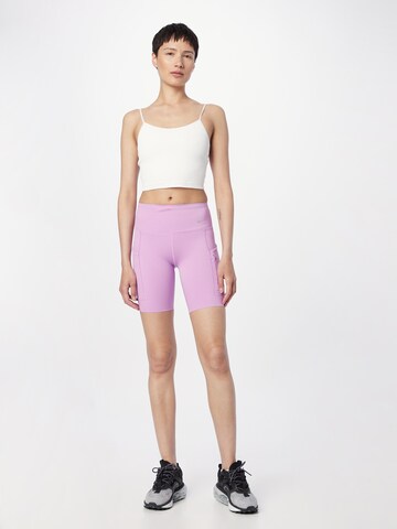 NIKE Skinny Spodnie sportowe w kolorze fioletowy