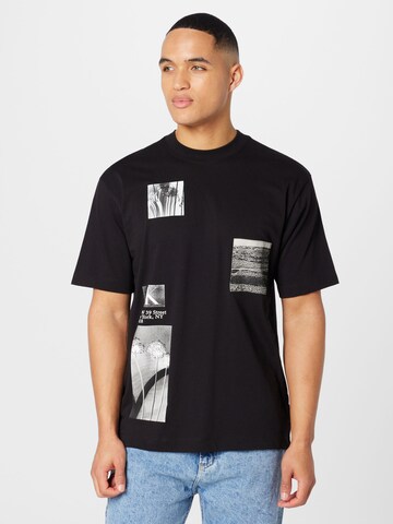 Tricou de la Calvin Klein Jeans pe negru: față