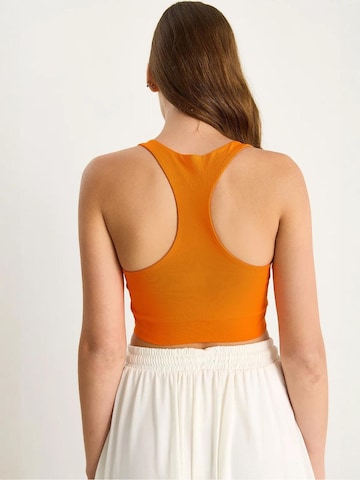 Haut Bianco Lucci en orange