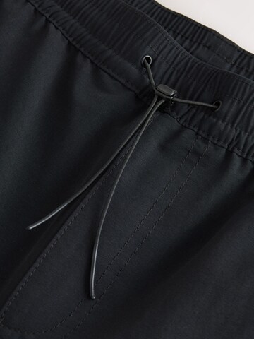 Next - Tapered Pantalón cargo en negro