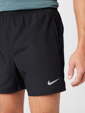 NIKE Regular Workout Pants in Black