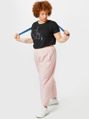 Loosefit Pantalon de sport Nike Sportswear en rose