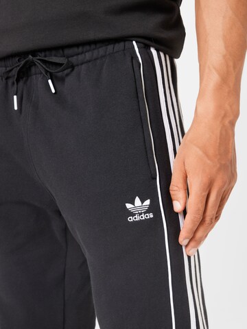 ADIDAS ORIGINALS Tapered Broek 'Rekive' in Zwart