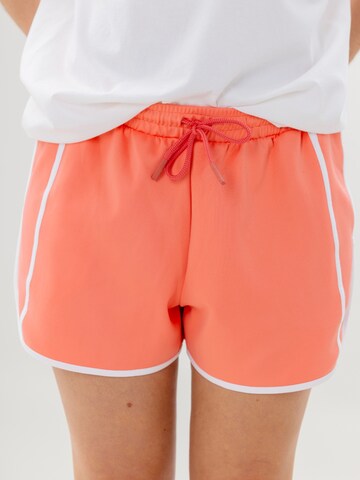 Hey Honey Loosefit Sportbroek 'PHOENIX' in Oranje: voorkant