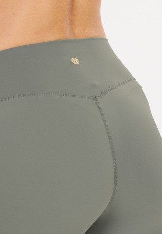 Athlecia Skinny Workout Pants 'Luxe' in Brown