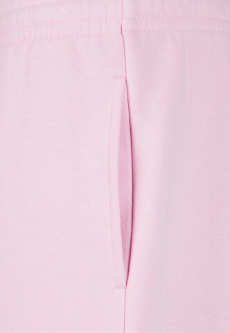 Effilé Pantalon 'Fluffy' Urban Classics en rose