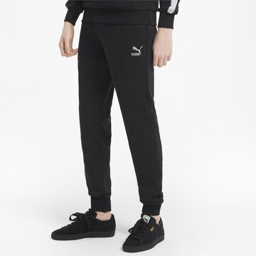 PUMA Tapered Sportbroek in Zwart: voorkant