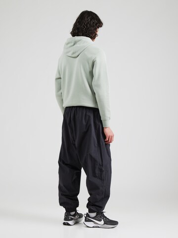Nike Sportswear Дънки Tapered Leg Панталон 'CLUB' в черно