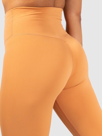 Smilodox Skinny Workout Pants 'Affectionate' in Orange