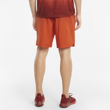 PUMA Regular Workout Pants in Orange