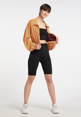 regular Pantaloni cargo di myMo ATHLSR in arancione
