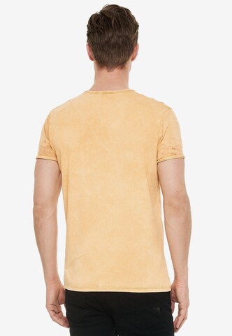 Rusty Neal Cooles T-Shirt mit angesagtem Print in Orange