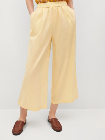 Wide leg Pantaloni con pieghe 'Wave' di MANGO in giallo: frontale