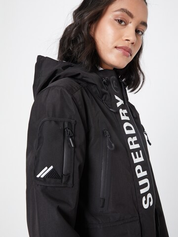 Superdry Snow Kültéri kabátok 'Ultimate Rescue' - fekete