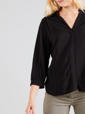 QS - Blusa en negro