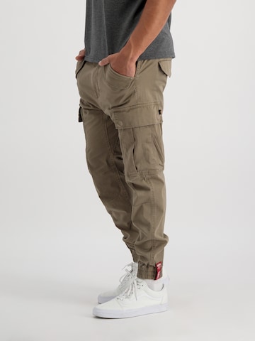 ALPHA INDUSTRIES Tapered Cargo trousers 'Airman' in Green: front