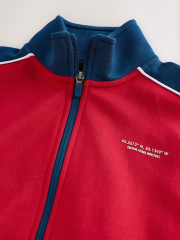 Next Jopa na zadrgo | rdeča barva