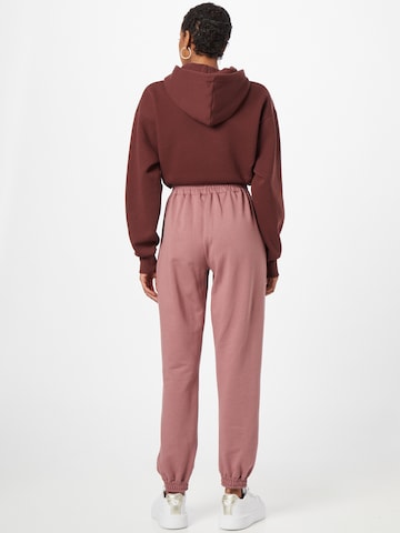 ABOUT YOU Tapered Sweatpants 'Naomi' in Pink