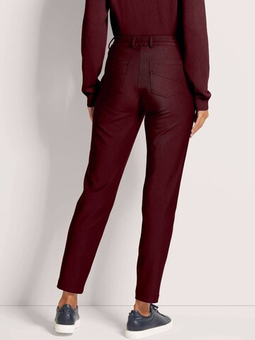 MADELEINE Slim fit Trousers in Red