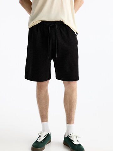 Largi Pantaloni de la Pull&Bear pe negru: față