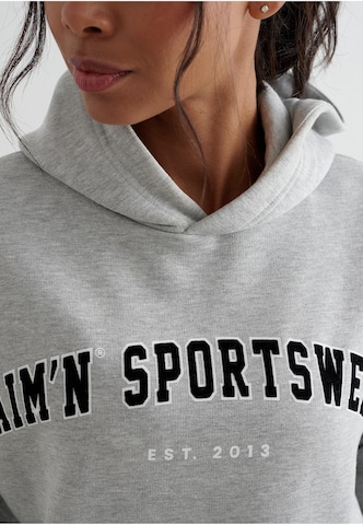 Sweat de sport Aim'n en gris