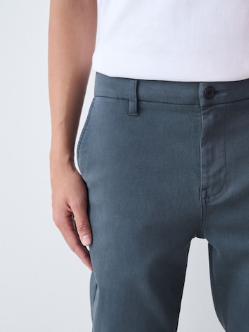 Next Slimfit Chinobyxa i blå