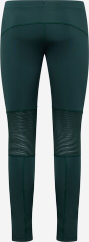 Skinny Pantaloni sportivi di ASICS in verde