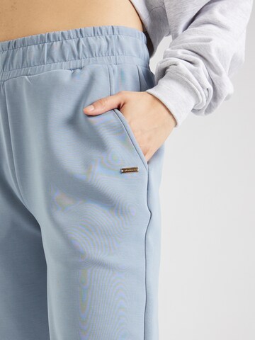 Tapered Pantaloni sportivi di Athlecia in blu