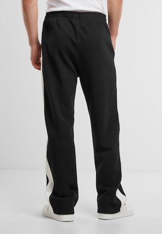 regular Pantaloni sportivi di Karl Kani in nero