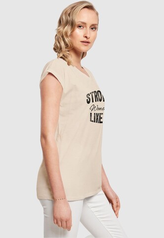 Merchcode T-Shirt 'WD - Strong Like A Woman' in Beige