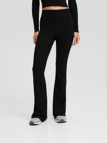 Bershka Flared Trousers in Black: front