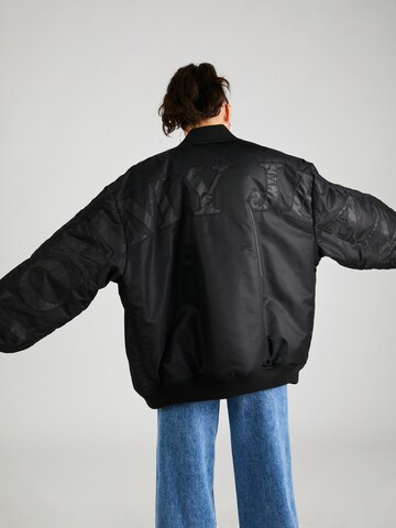 Tommy Jeans Prechodná bunda - Čierna
