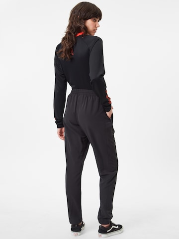 Effilé Pantalon de sport Hummel en noir