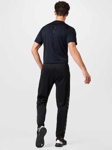 Effilé Pantalon de sport 'Legacy' Hummel en noir