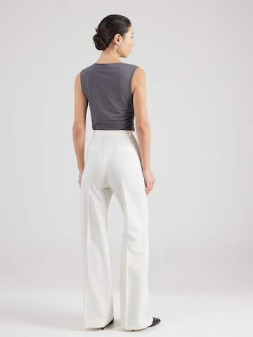 Copenhagen Studios Široke hlačnice Hlače na rob | bež barva