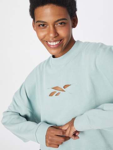 Reebok - Sweatshirt de desporto em cinzento