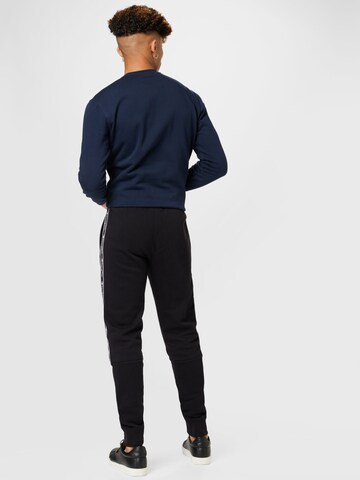 Champion Authentic Athletic ApparelTapered Hlače - crna boja