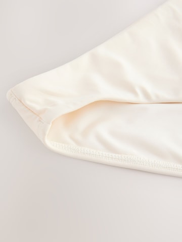 Next Bikinihousut värissä beige