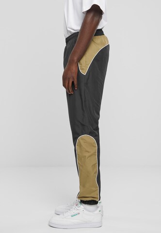Urban Classics Tapered Sports trousers in Black