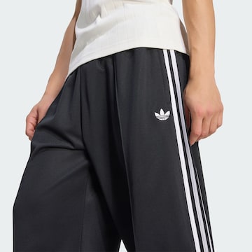 Wide leg Pantaloni di ADIDAS ORIGINALS in nero
